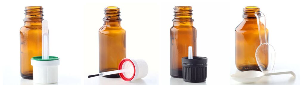 Pipettes, brushes, drip dispensers and measuring spoons fill glass vials for essential oils